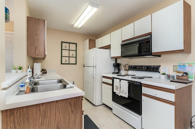 kitchen with sink, white cabinetry, a textured ceiling, range with electric stovetop, and white refrigerator