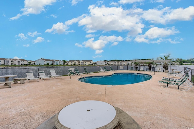 view of swimming pool with a patio area