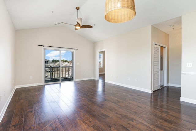 empty room featuring high vaulted ceiling, baseboards, ceiling fan, and wood finished floors