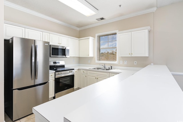 kitchen featuring visible vents, ornamental molding, a sink, and stainless steel appliances