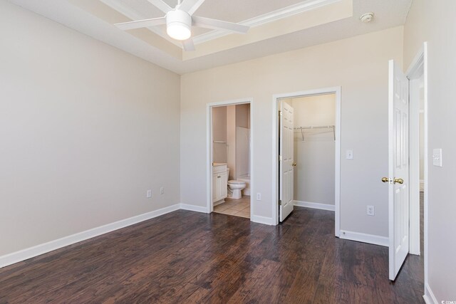 living room featuring ceiling fan with notable chandelier, dark hardwood / wood-style flooring, and lofted ceiling