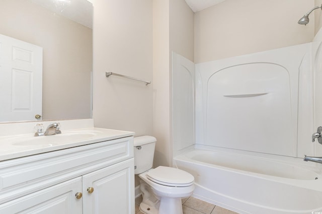 bathroom with toilet, tile patterned floors, vanity, and washtub / shower combination