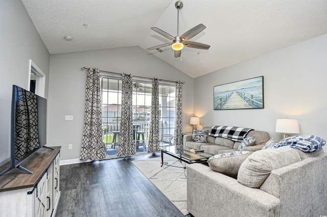 living room with ceiling fan, vaulted ceiling, a textured ceiling, and hardwood / wood-style floors