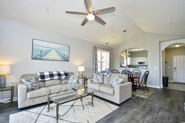 5801 Oyster Catcher Dr Unit 434, North Myrtle Beach, SC 29582 - living room with wood finished floors, vaulted ceiling, ceiling fan, arched walkways, and a chandelier