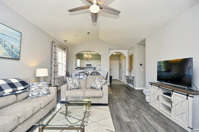 5801 Oyster Catcher Dr Unit 434, North Myrtle Beach, SC 29582 - living room featuring arched walkways, wood finished floors, a ceiling fan, vaulted ceiling, and a textured ceiling