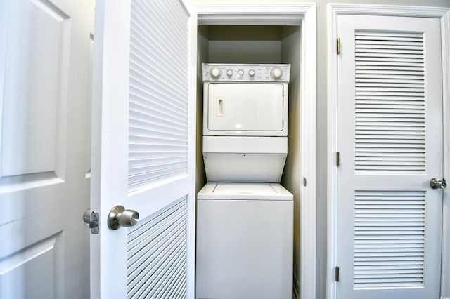 laundry area featuring stacked washer and dryer