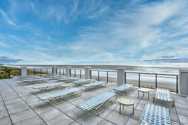 view of patio featuring a water view