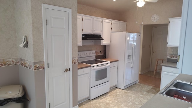 kitchen featuring white cabinetry, a sink, ceiling fan, white appliances, and under cabinet range hood