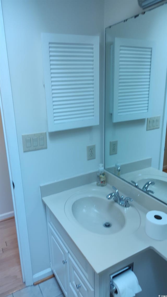 bathroom featuring baseboards and vanity