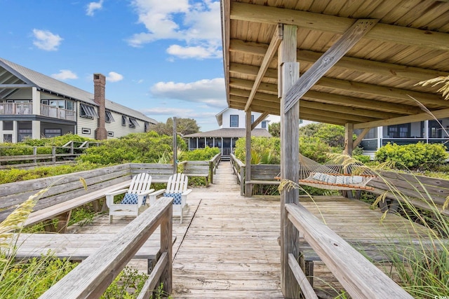 view of dock with a balcony