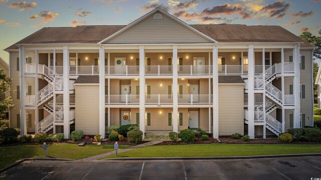 view of outdoor building at dusk