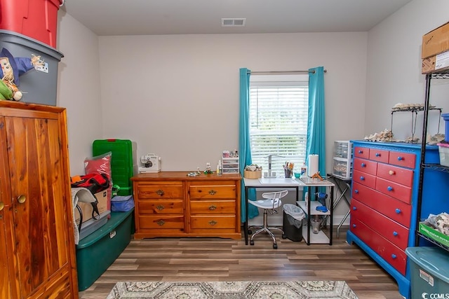 office space with dark wood-type flooring