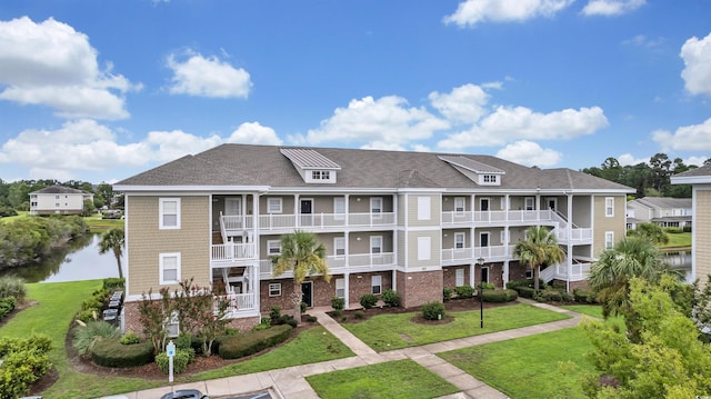 view of building exterior with a water view