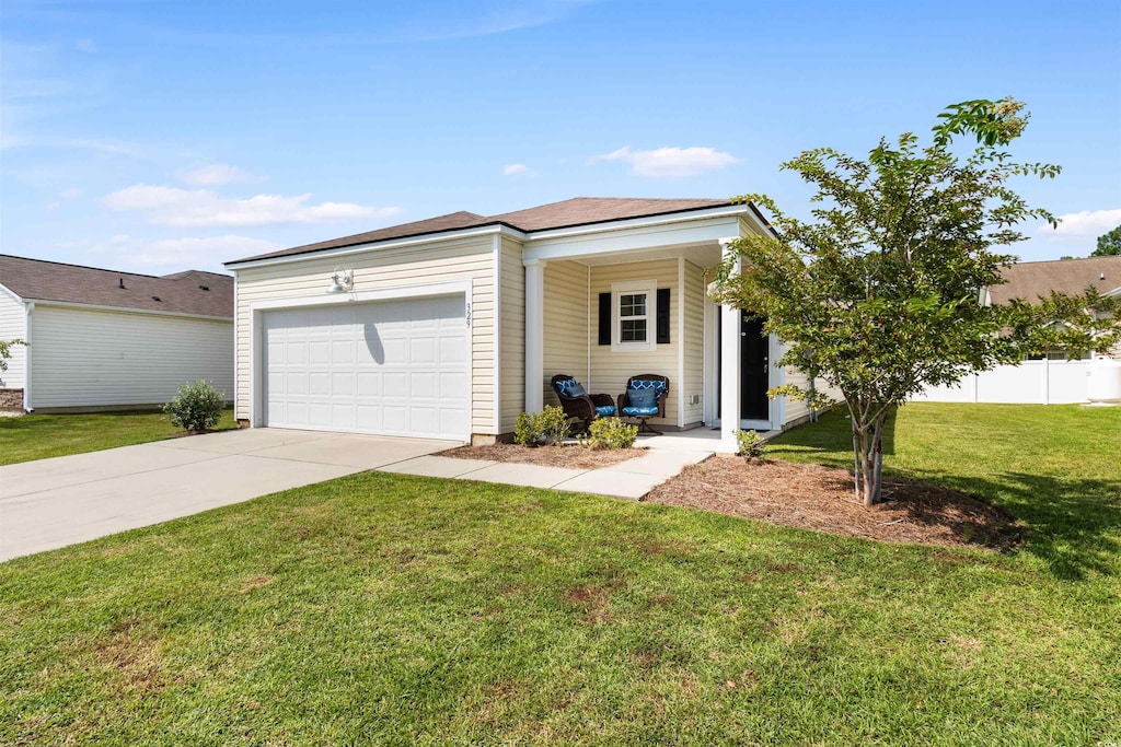 single story home with a front yard and a garage