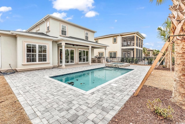 view of pool featuring an in ground hot tub, ceiling fan, and a patio