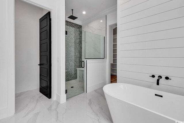 bathroom featuring crown molding and independent shower and bath