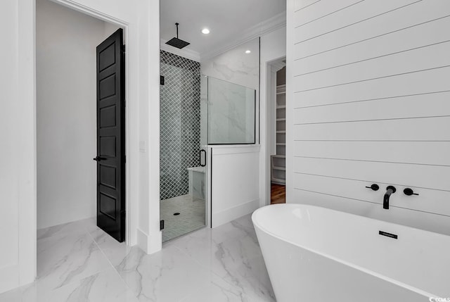 bathroom with crown molding and separate shower and tub