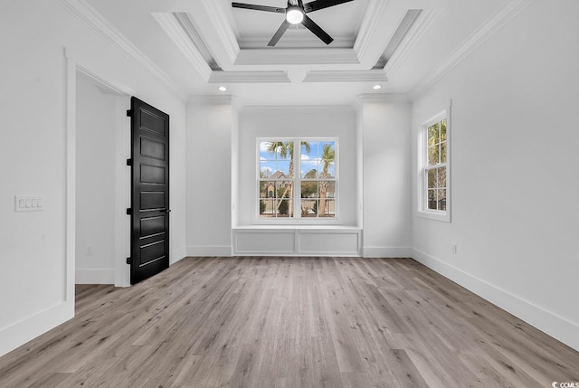 spare room featuring ceiling fan, ornamental molding, and light wood-type flooring