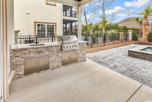 view of patio featuring area for grilling, grilling area, and sink