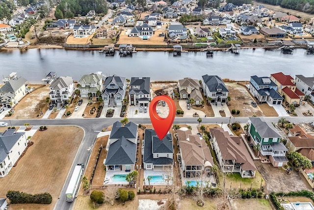 birds eye view of property featuring a water view