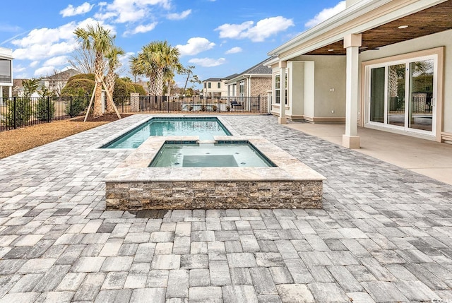 view of pool featuring an in ground hot tub and a patio area