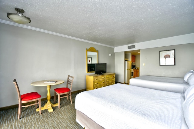 carpeted bedroom with a textured ceiling and crown molding