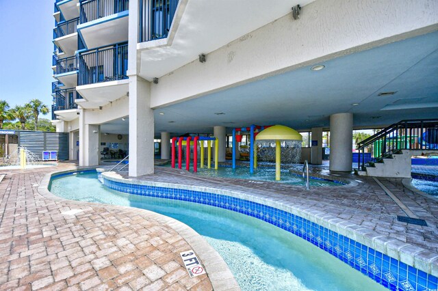 view of pool featuring a patio area