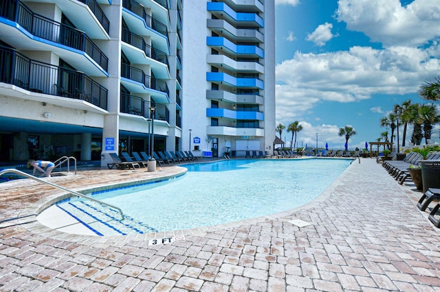 view of pool featuring a patio area