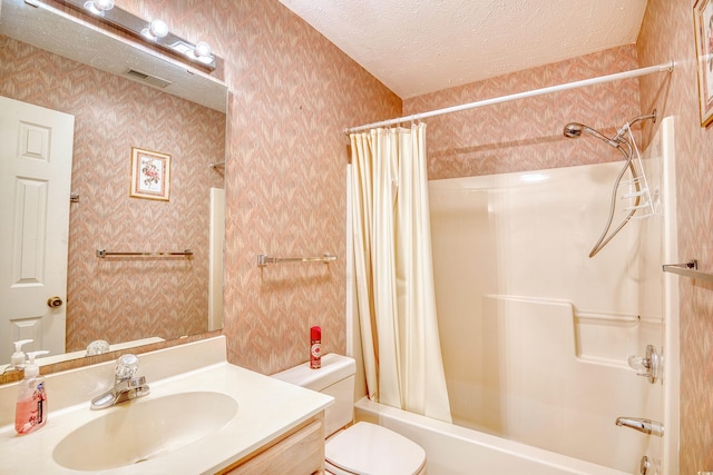 full bathroom featuring a textured ceiling, toilet, shower / tub combo, and vanity