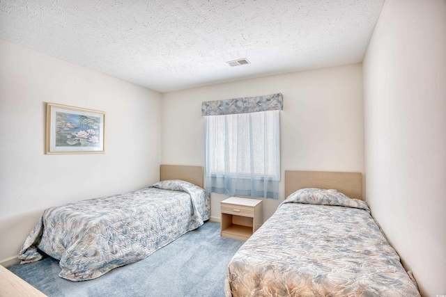 4103 Pinehurst Cir Unit Bb-12, Little River, SC 29566 - bedroom with carpet floors and a textured ceiling