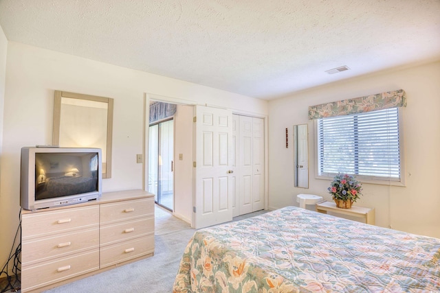 4103 Pinehurst Cir Unit Bb-12, Little River, SC 29566 - bedroom featuring light colored carpet and a textured ceiling