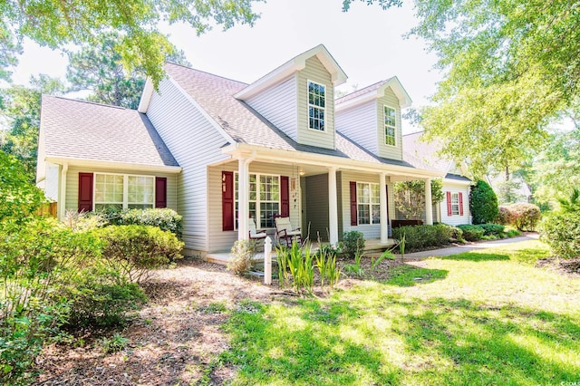 cape cod-style house with a porch and a front lawn