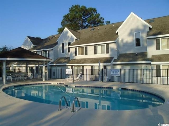 view of swimming pool featuring a gazebo and a patio