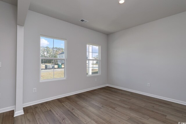 office space featuring dark hardwood / wood-style floors and crown molding