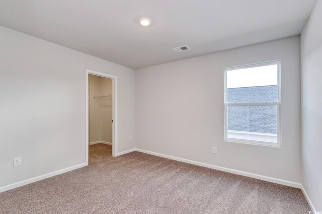 bedroom featuring light colored carpet