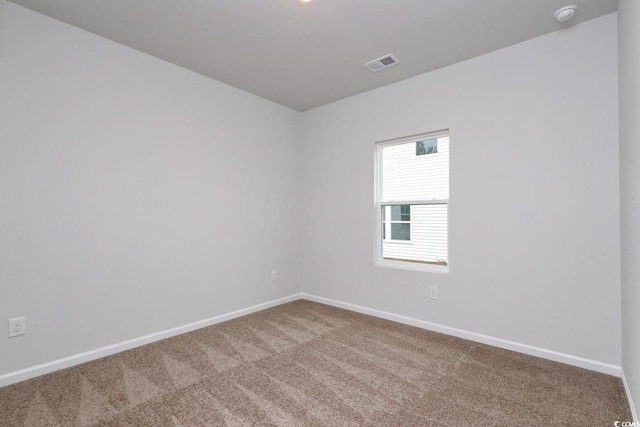 unfurnished room featuring carpet flooring