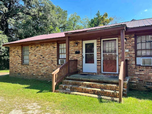 property entrance with a yard