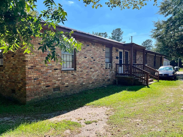 view of side of property with a yard