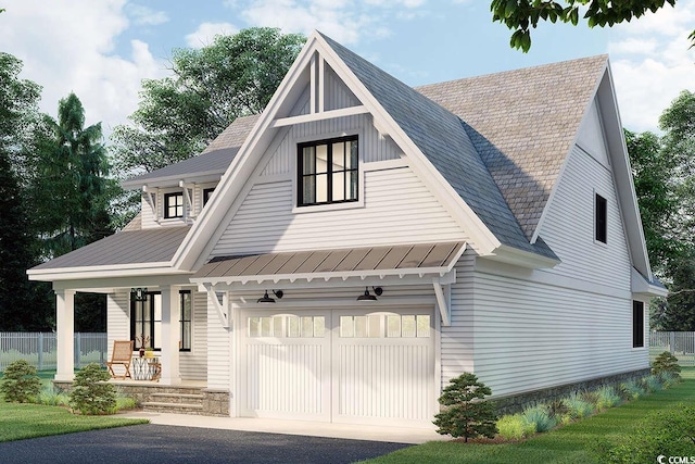 view of front of property with an attached garage, fence, driveway, and a porch