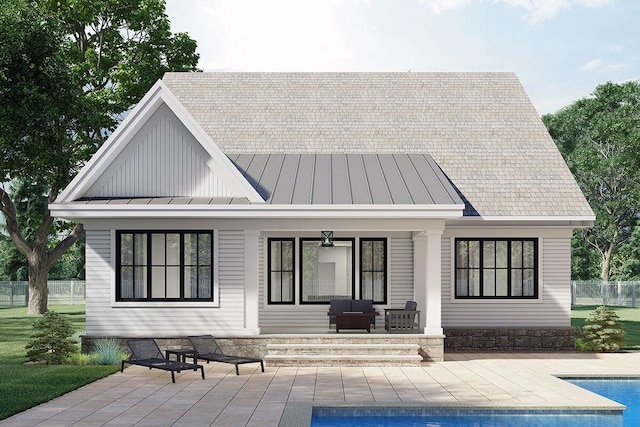 back of house featuring a patio area and covered porch