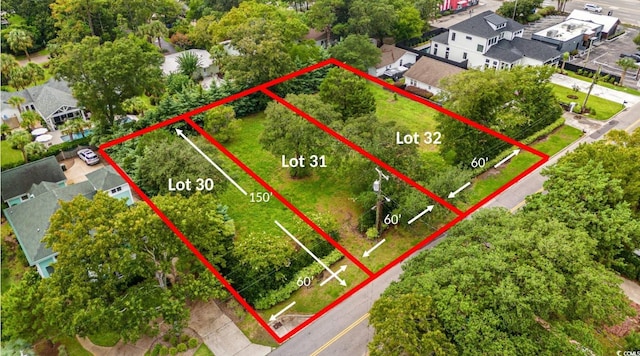 birds eye view of property with a residential view
