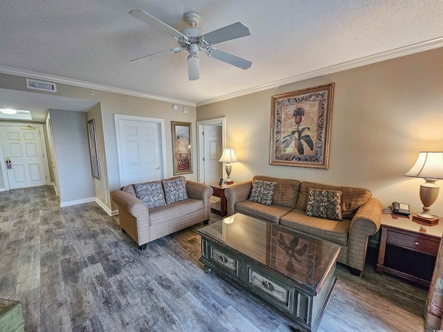 living room featuring ornamental molding, dark hardwood / wood-style flooring, and a textured ceiling