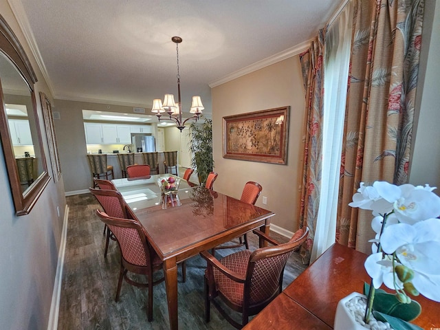 dining area with ornamental molding, dark hardwood / wood-style floors, and a chandelier