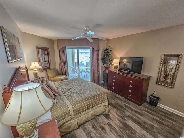 bedroom featuring dark wood-type flooring, ceiling fan, a textured ceiling, and access to outside