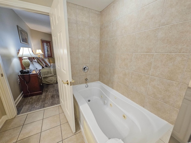 bathroom featuring tile patterned floors and a bathing tub