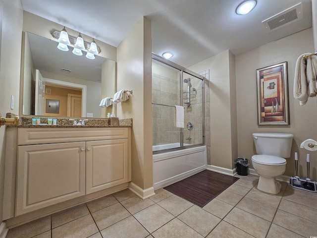 full bathroom with enclosed tub / shower combo, toilet, tile patterned floors, and vanity