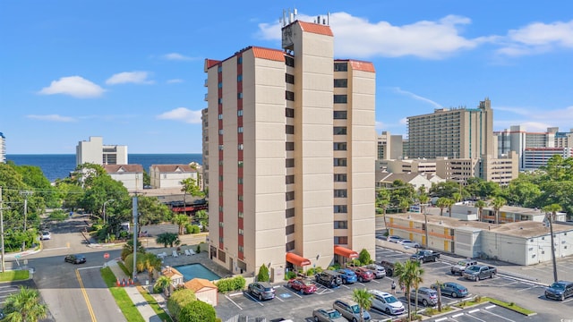 7509 N Ocean Blvd Unit 103, Myrtle Beach, SC 29572 - view of building exterior with uncovered parking, a water view, and a view of city