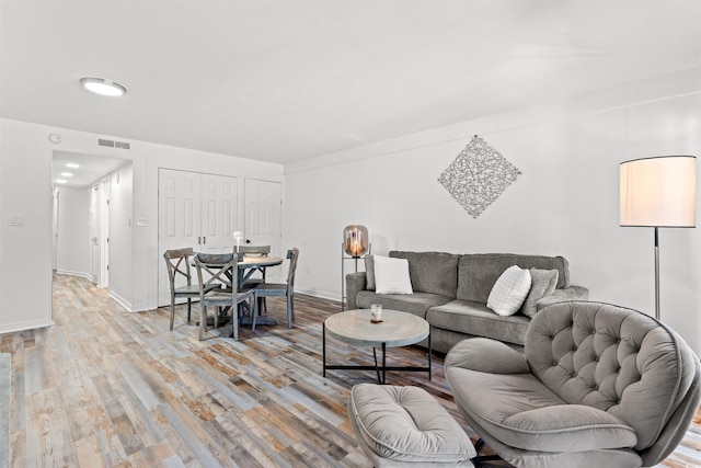 7509 N Ocean Blvd Unit 103, Myrtle Beach, SC 29572 - living area featuring light wood-type flooring and baseboards