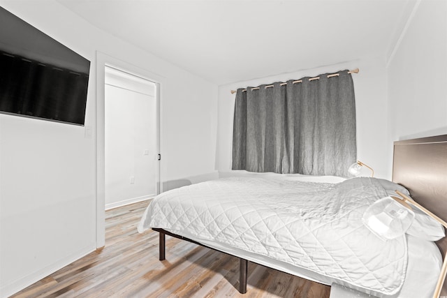 bedroom featuring hardwood / wood-style floors