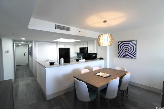 dining room featuring dark hardwood / wood-style floors